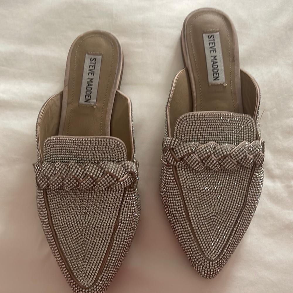 A pair of diamanté Steve Madden slippers .